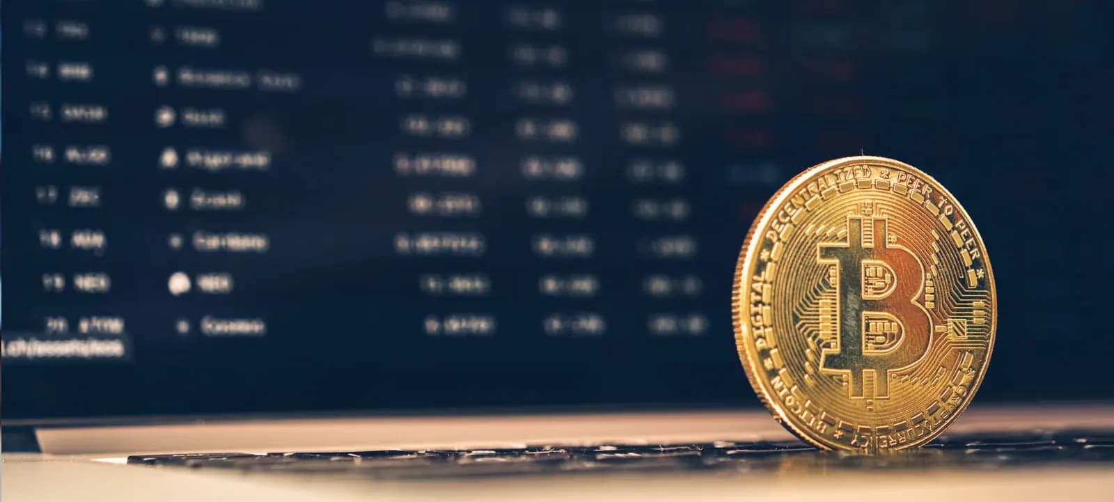 Bitcoin coin beside a price list