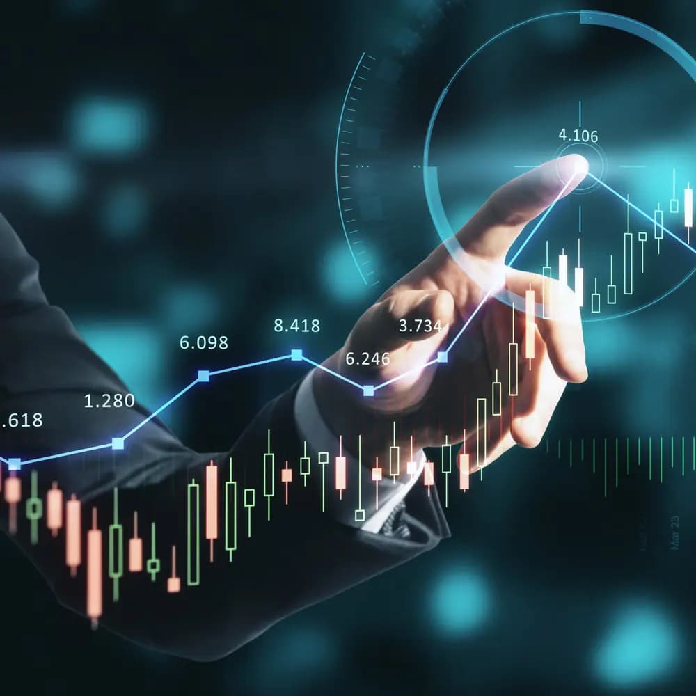 Hand touching a glowing price chart